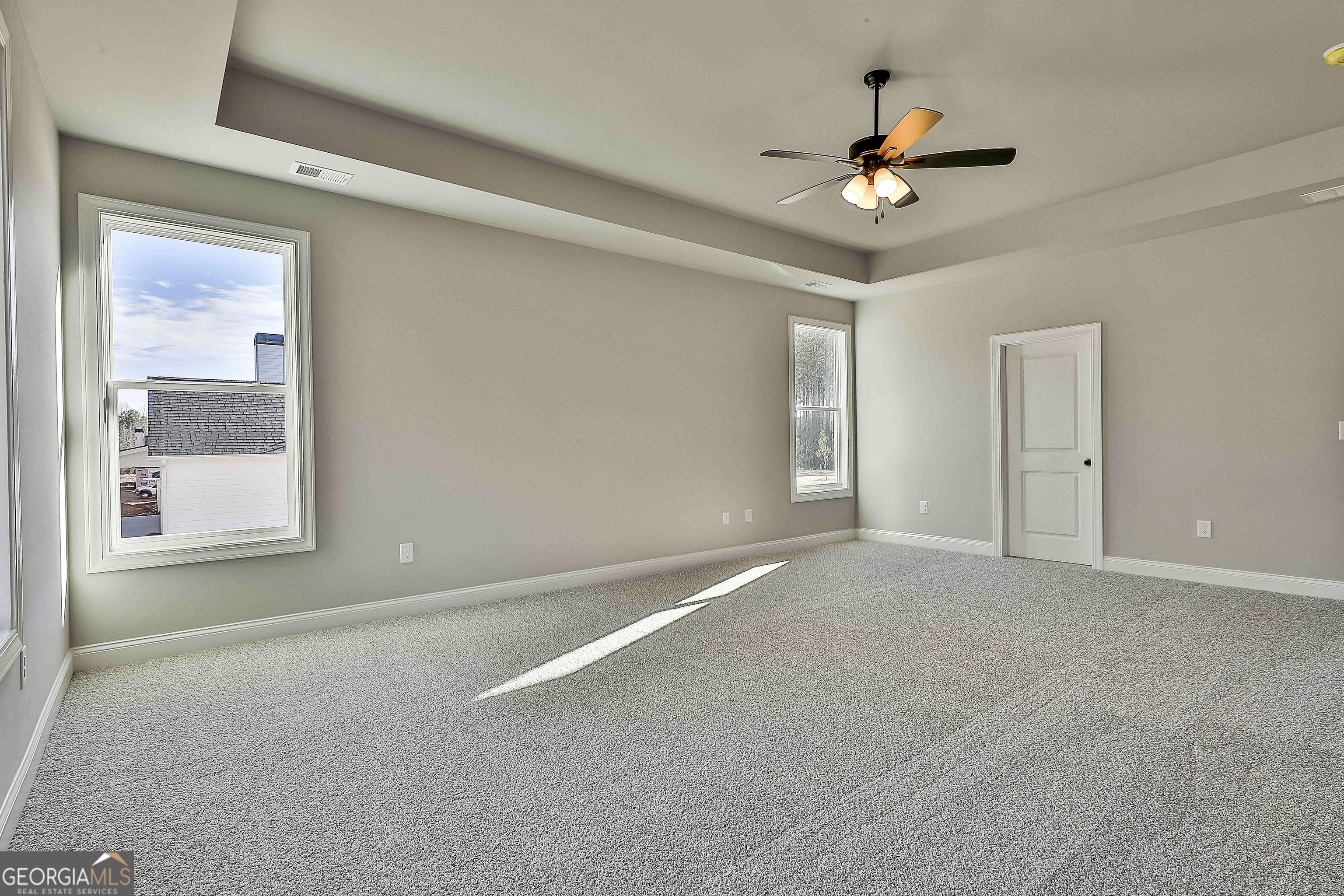 174 Tattersall Way, Unit 5100 Senoia, GA 30276 - Photo 28 of 40 a view of an empty room with a window