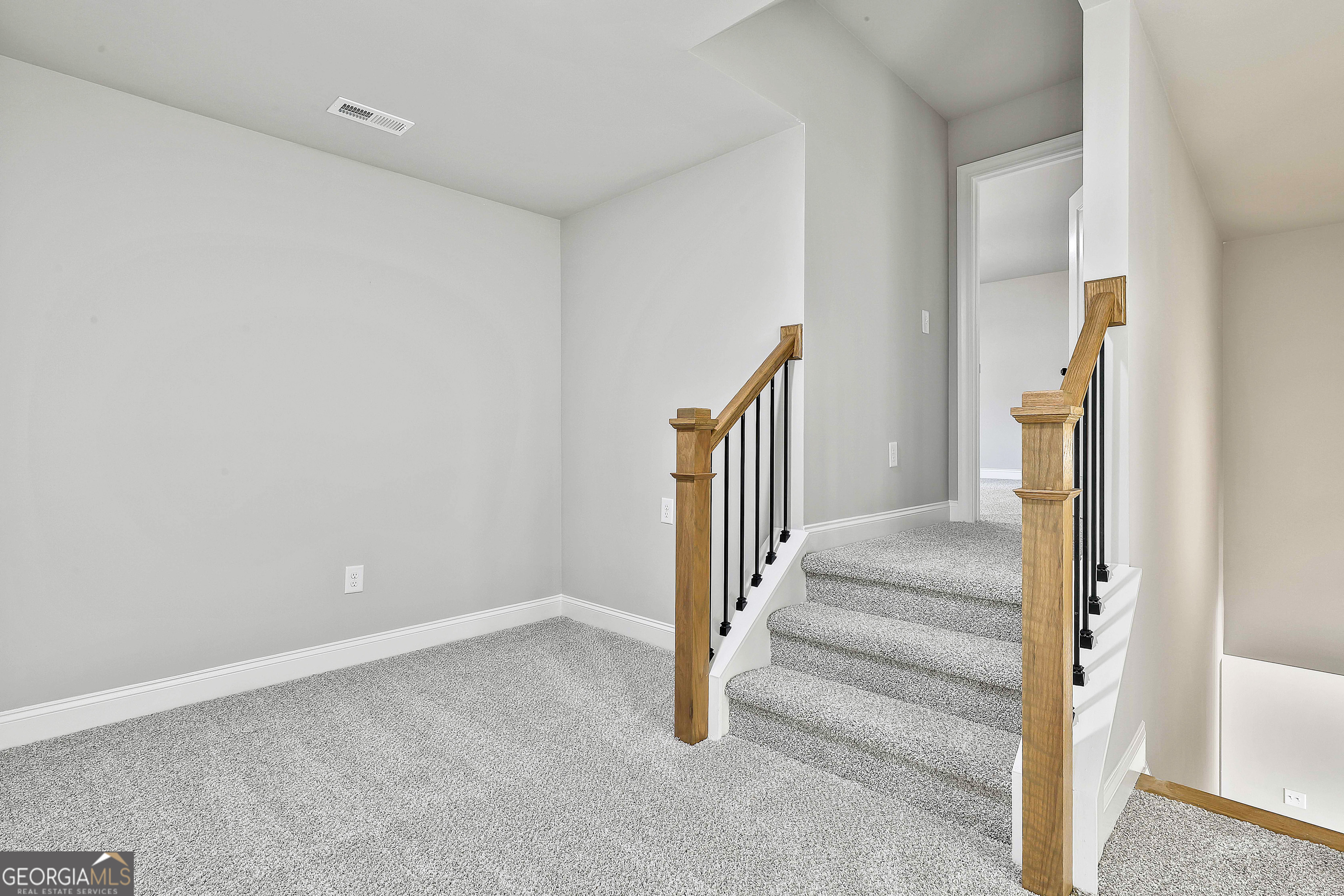 174 Tattersall Way, Unit 5100 Senoia, GA 30276 - Photo 34 of 40 a view of entryway with wooden floor