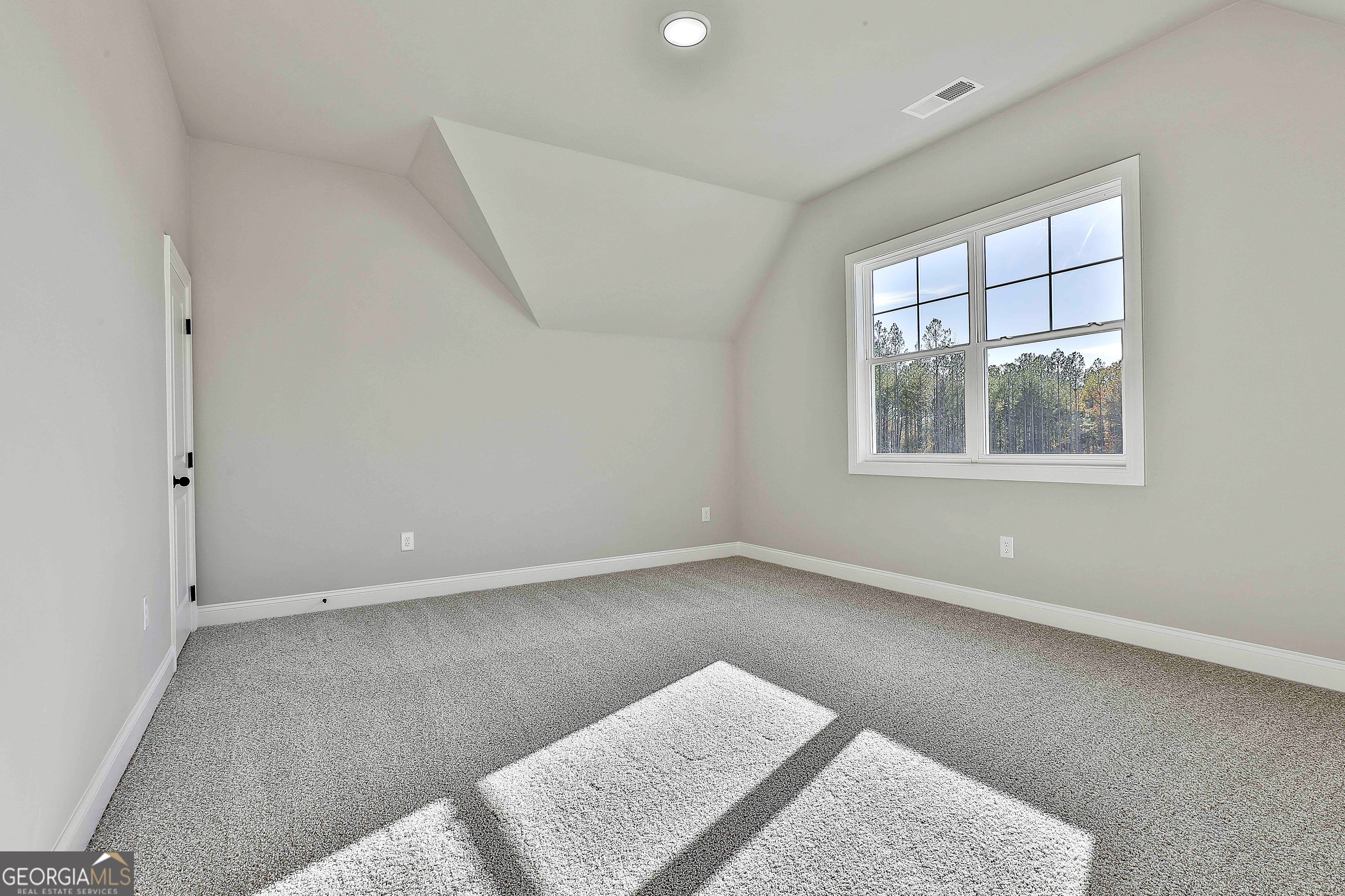 174 Tattersall Way, Unit 5100 Senoia, GA 30276 - Photo 37 of 40 an empty room with windows