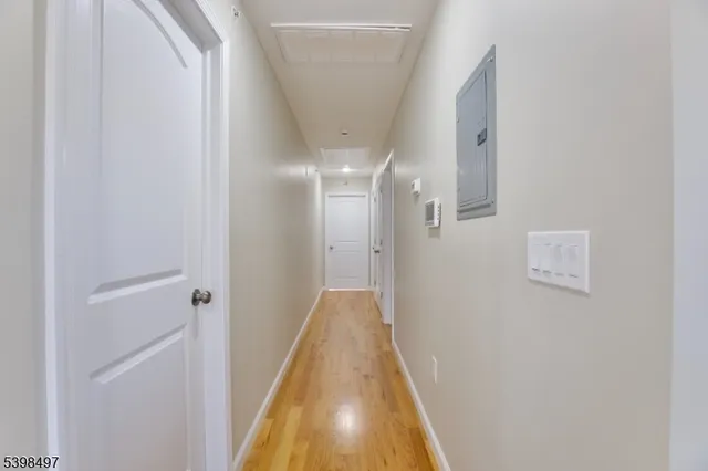 a view of a hallway with a white door