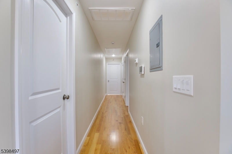32 Garibaldi Avenue, Unit 3 Newark, NJ 07114 - Photo 7 of 20 a view of a hallway with a white door