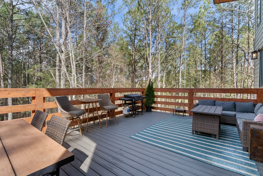 126 Hummingbird Way Copperhill, TN 37317 - Photo 41 of 47 an outdoor sitting area with couch and wooden floor