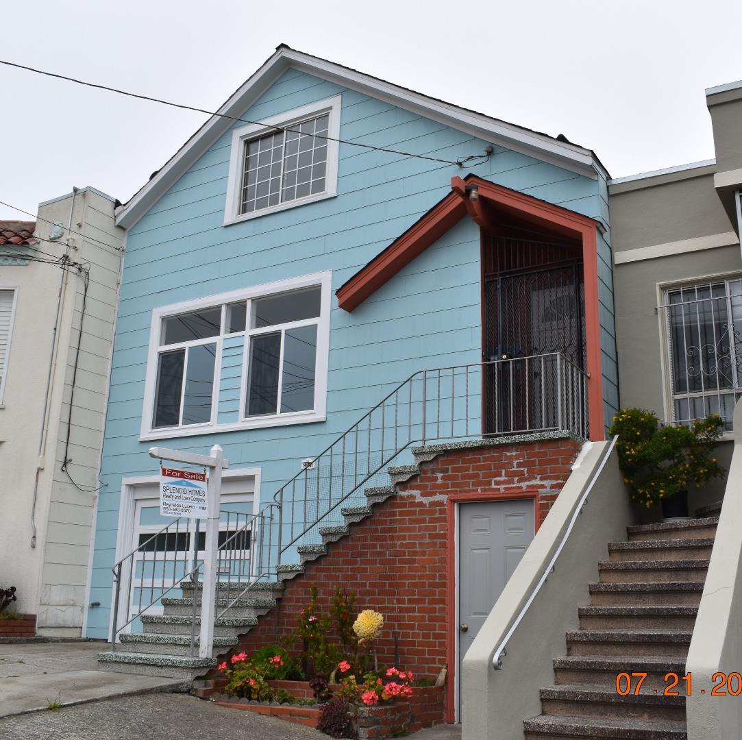 a view of a house with wooden stairs