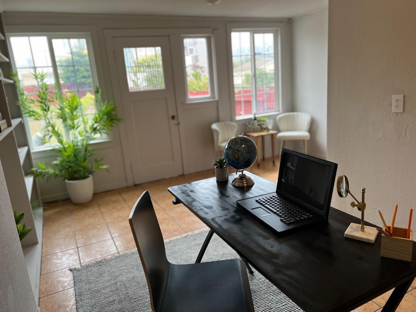 2270 22nd Avenue San Francisco, CA 94116 - Photo 12 of 12 a view of a workspace with furniture and a potted plant