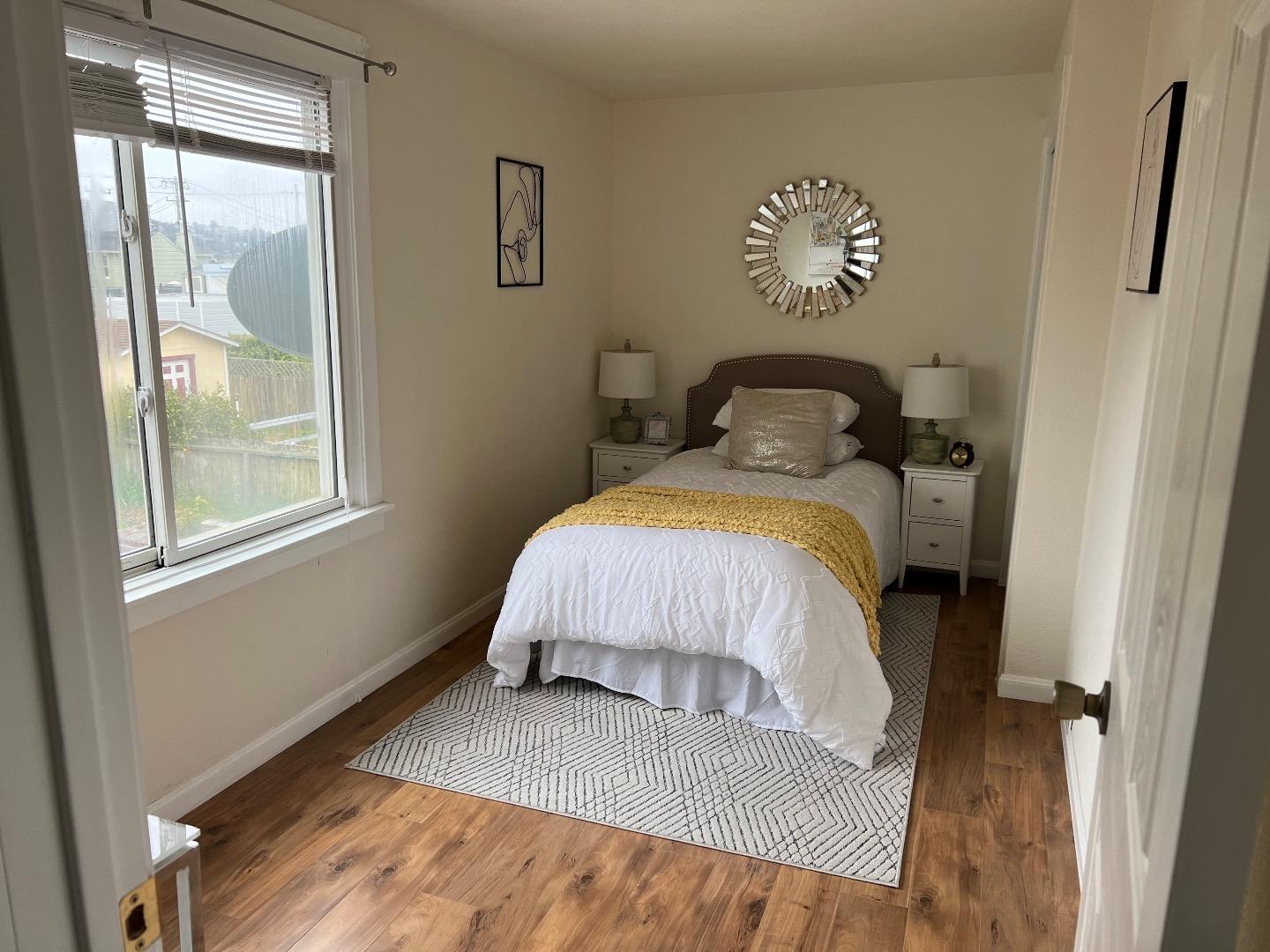 2270 22nd Avenue San Francisco, CA 94116 - Photo 7 of 12 a bedroom with a bed and window