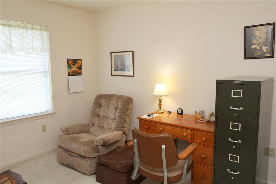 1282 Old Gate Road Northampton, PA 18067 - Photo 13 of 18 A well-lit study with a desk, recliner, and ample natural light from a window.