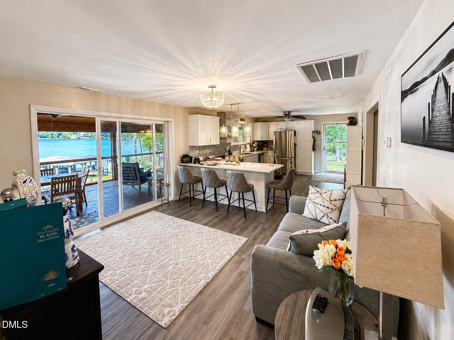 118 Paradise Point Macon, NC 27551 - Photo 11 of 28 a living room with furniture and a large window