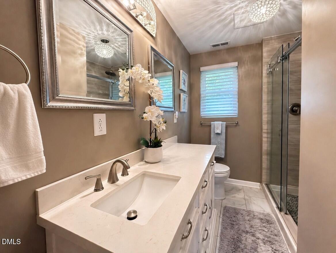 118 Paradise Point Macon, NC 27551 - Photo 13 of 28 a bathroom with a sink and a mirror