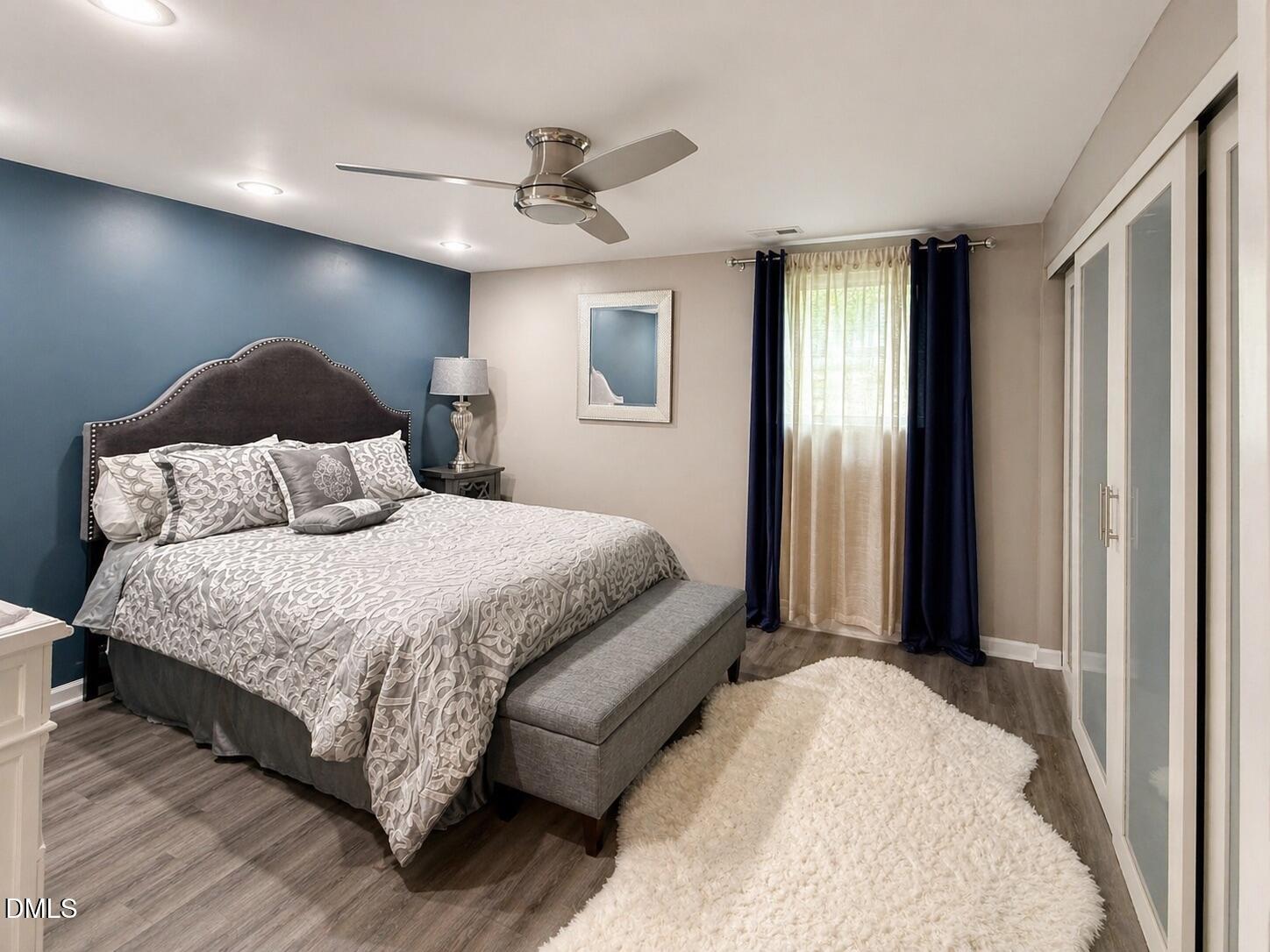 118 Paradise Point Macon, NC 27551 - Photo 17 of 28 a bedroom with a bed and lamp