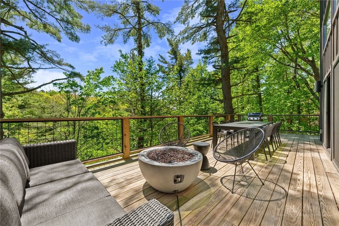 1385 Niley Cook Road Blowing Rock, NC 28605 - Photo 33 of 40 a view of a chairs and table on the roof deck