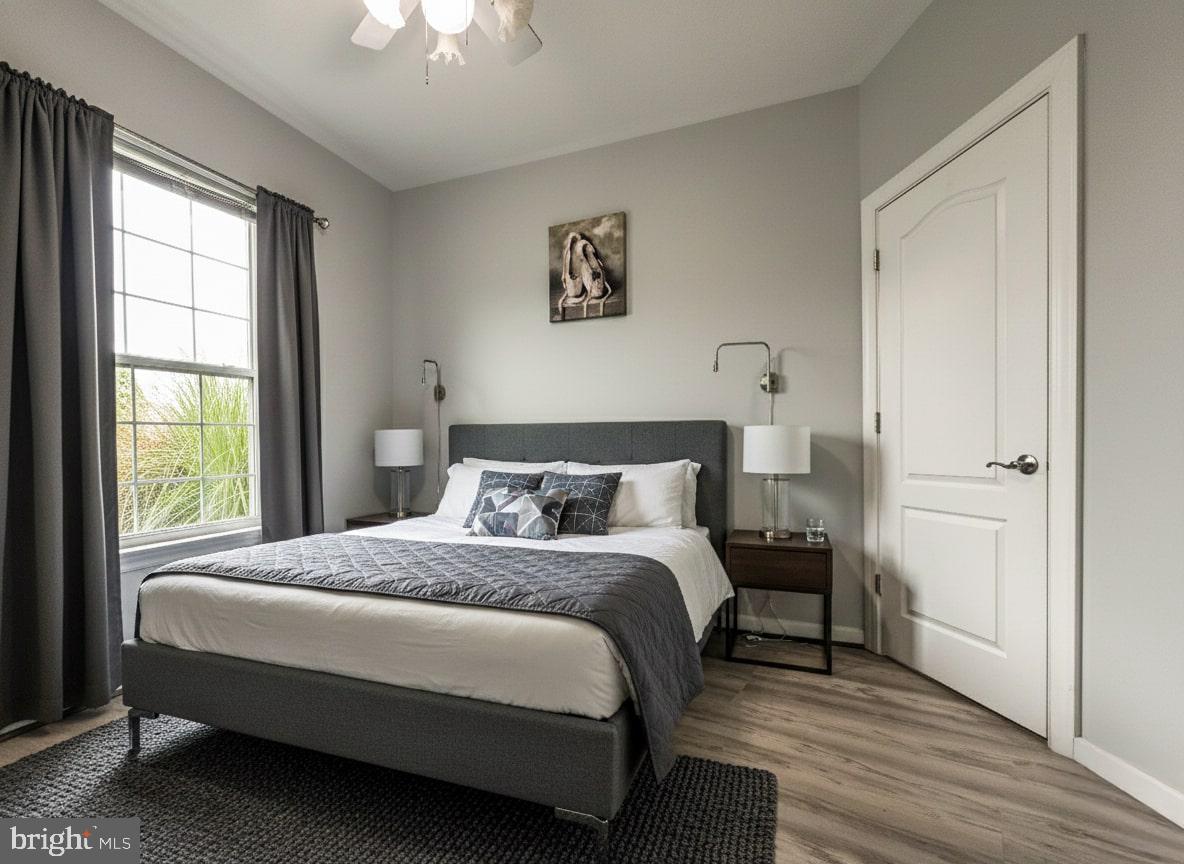 7444 Riding Meadow Way Manassas, VA 20111 - Photo 13 of 36 a bedroom with a bed and a window