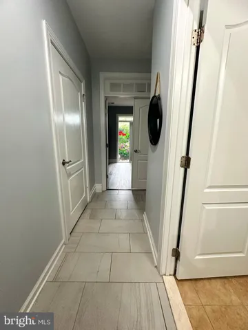 a view of entryway and kitchen