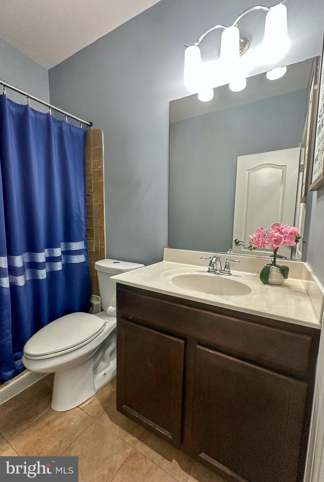 7444 Riding Meadow Way Manassas, VA 20111 - Photo 15 of 36 a bathroom with a sink toilet mirror and vanity
