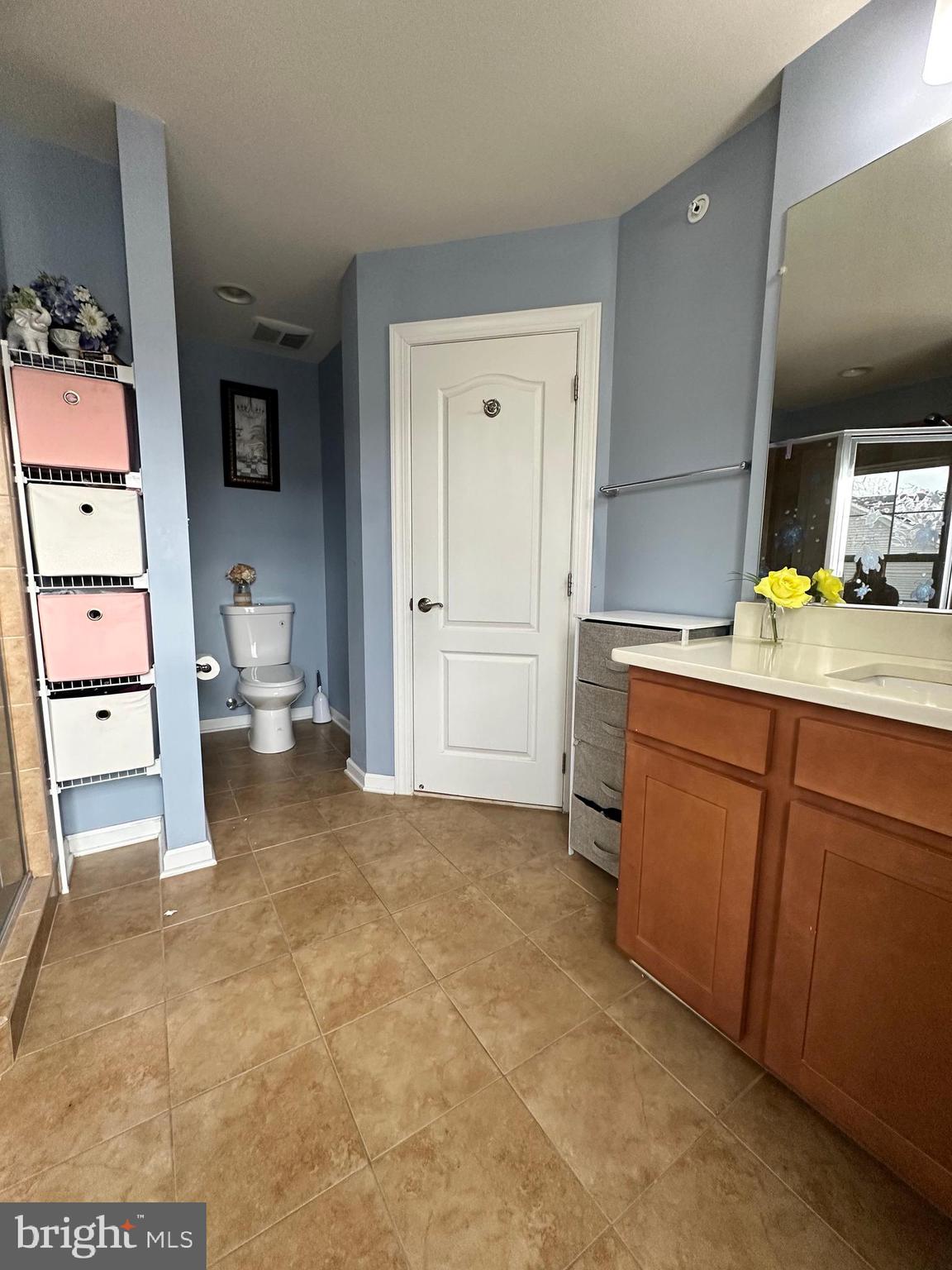 7444 Riding Meadow Way Manassas, VA 20111 - Photo 22 of 36 a utility room with cabinets washer and dryer
