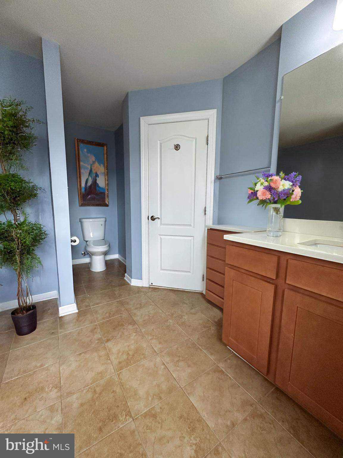 7444 Riding Meadow Way Manassas, VA 20111 - Photo 23 of 36 a view of a hallway with workspace and a potted plant