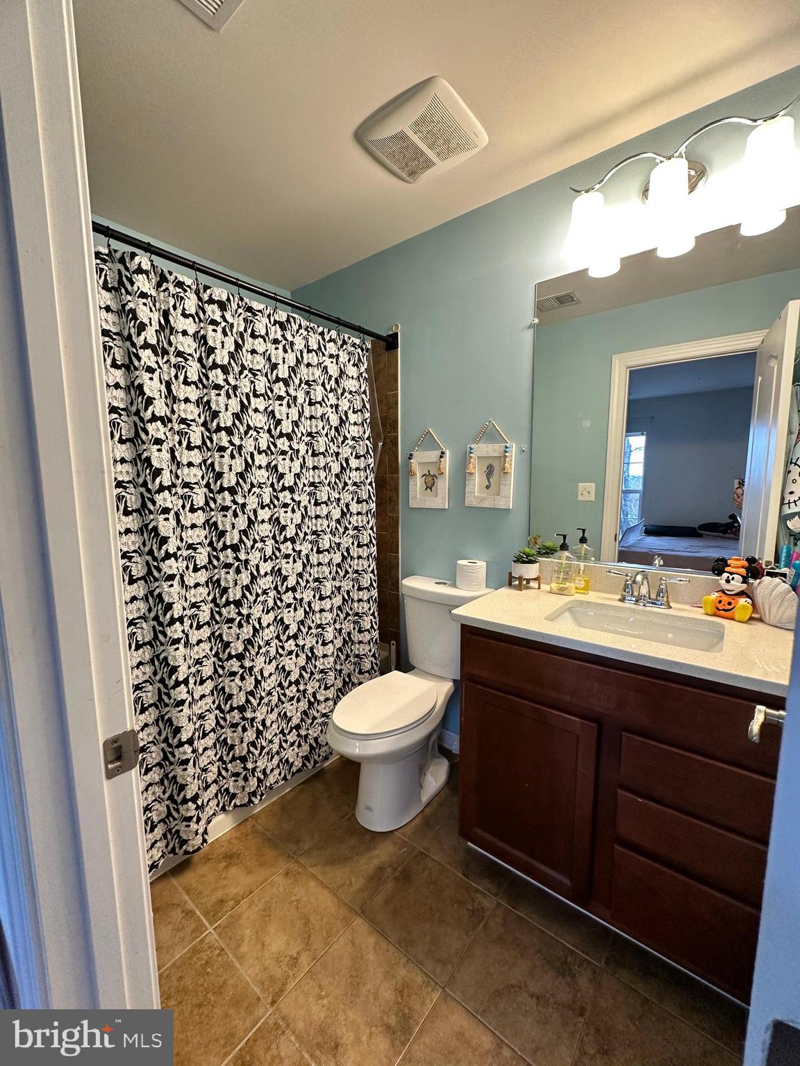 7444 Riding Meadow Way Manassas, VA 20111 - Photo 24 of 36 a bathroom with a toilet sink vanity and mirror