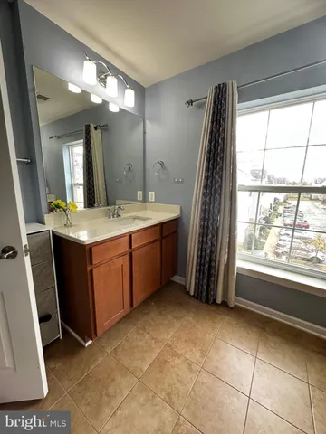 a bathroom with a sink a vanity and a mirror