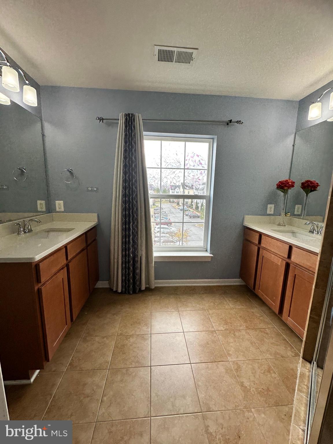 7444 Riding Meadow Way Manassas, VA 20111 - Photo 34 of 36 a bathroom with a sink a vanity and a mirror