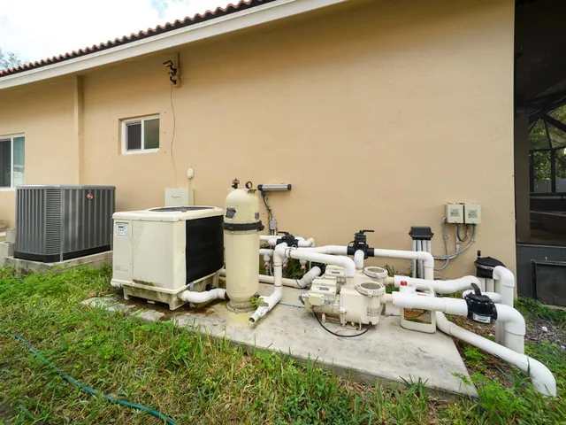a view of a house with backyard sitting area