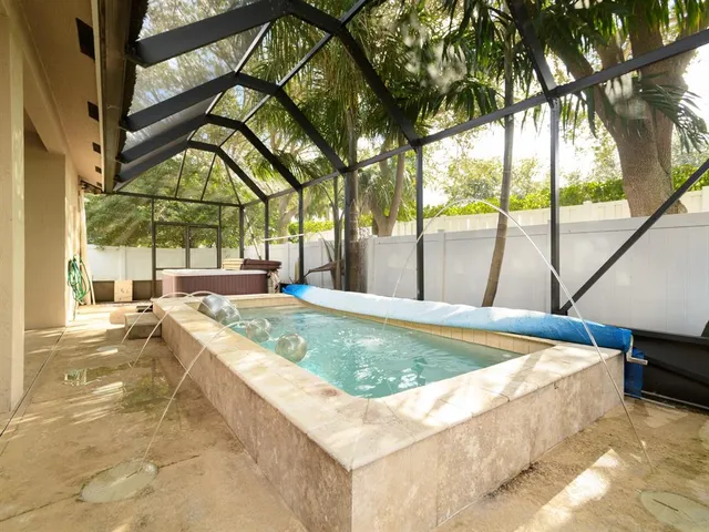 a view of a swimming pool with a patio