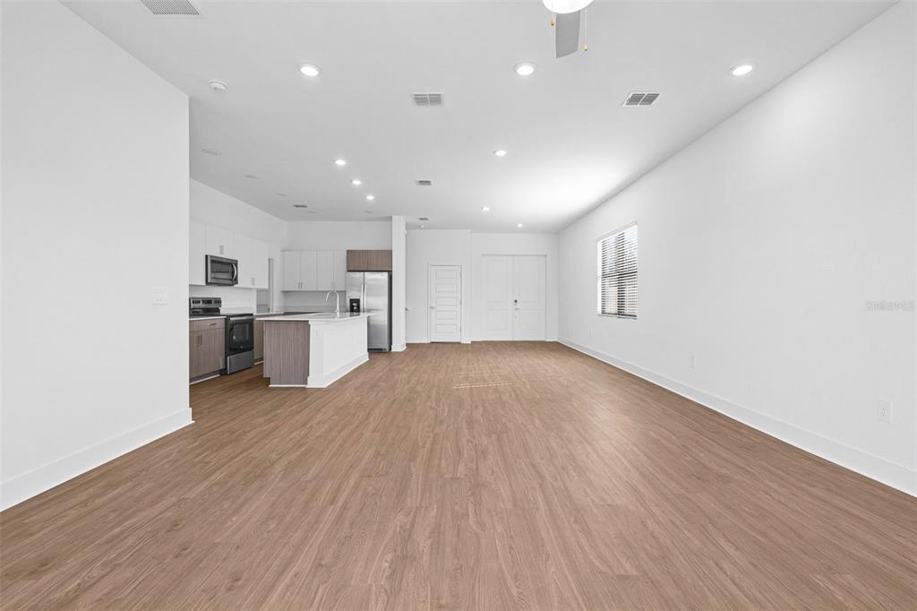 14413 Stellar Place Lakewood Ranch, FL 34202 - Photo 17 of 44 a view of kitchen with wooden floor and electronic appliances