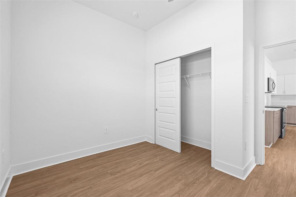 14413 Stellar Place Lakewood Ranch, FL 34202 - Photo 20 of 44 wooden floor in an empty room