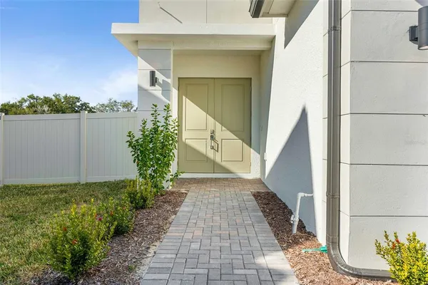 a view of a pathway besides a house