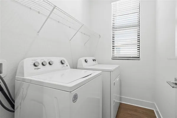 a utility room with dryer and washer