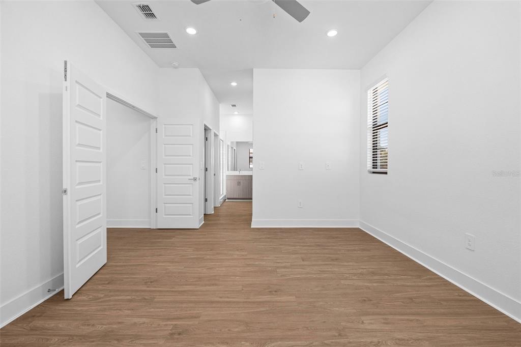 14413 Stellar Place Lakewood Ranch, FL 34202 - Photo 26 of 44 an empty room with wooden floor and closet