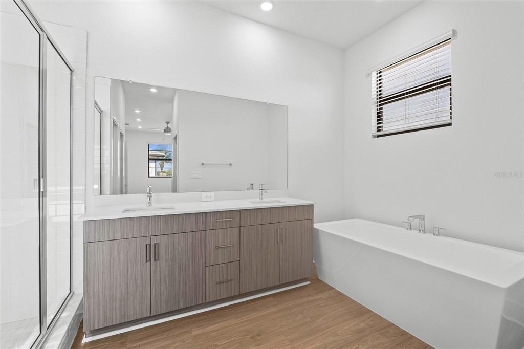 14413 Stellar Place Lakewood Ranch, FL 34202 - Photo 28 of 44 a bathroom with a double vanity sink mirror and bathtub