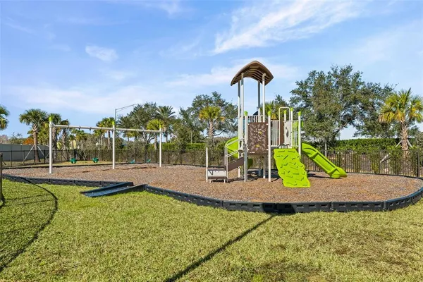 a view of a park with swings and slides