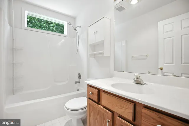 a bathroom with a sink a toilet and a bathtub