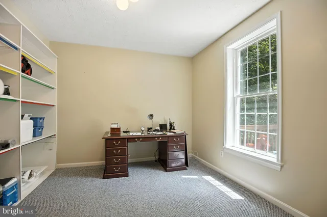 a view of workspace with furniture and windows