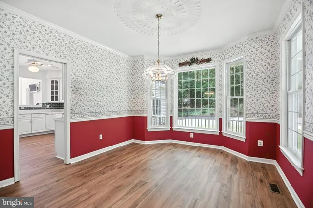 a view of livingroom with furniture wooden floor and windows
