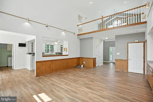 a view of an entryway with wooden floor