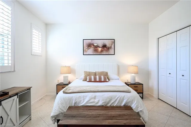 a bedroom with a bed and a dresser