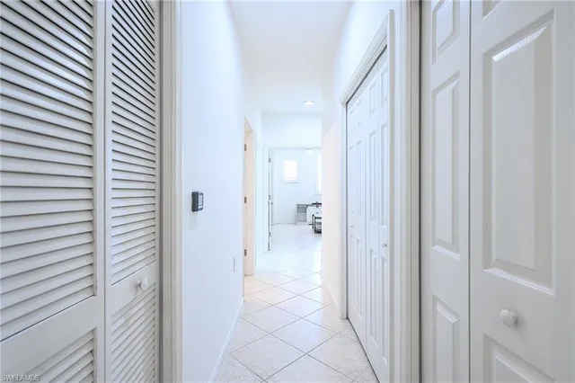 a kitchen with appliances a sink and cabinets
