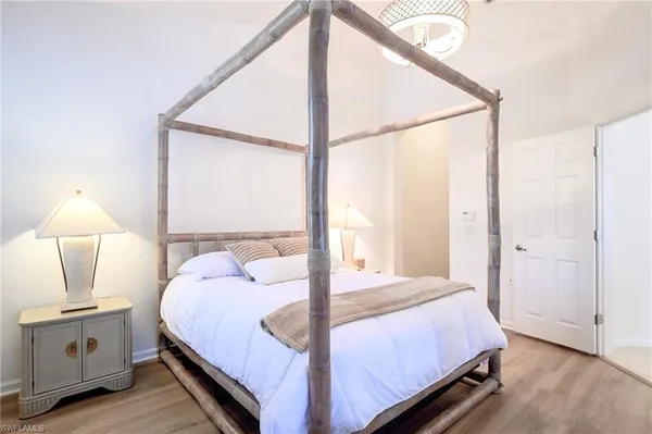 a balcony with chairs and wooden floor