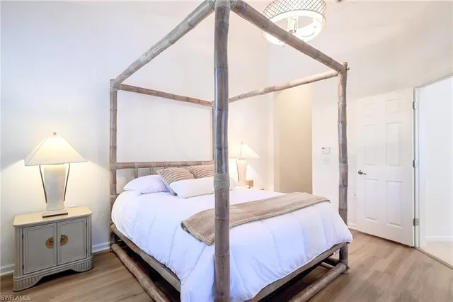 a balcony with chairs and wooden floor