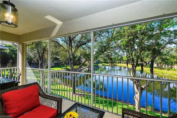 a view of a balcony with chairs