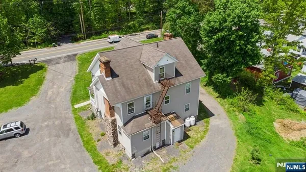an aerial view of a house with outdoor space