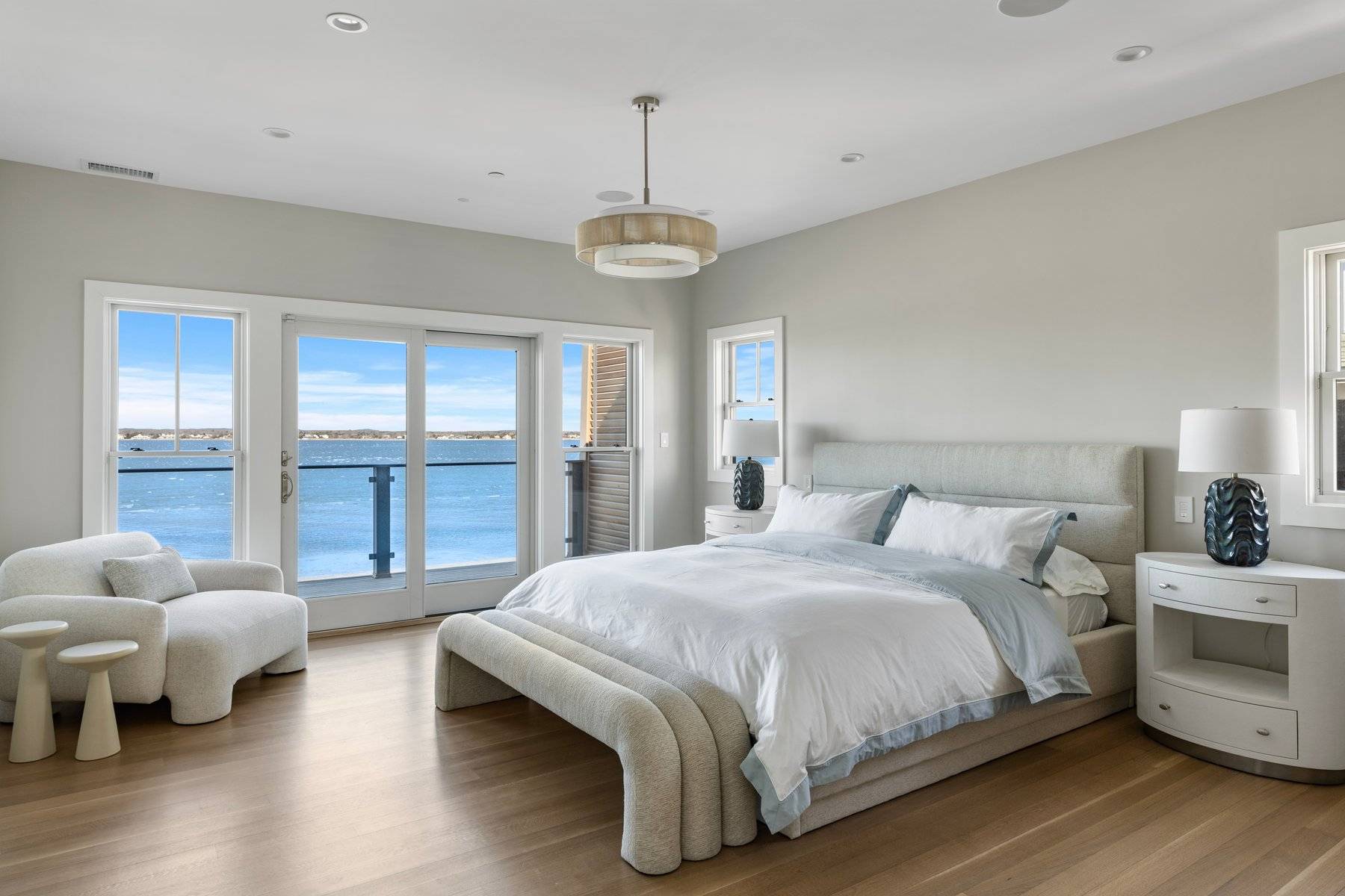 686 Dune Road Westhampton Beach, NY 11978 - Photo 22 of 37 a bedroom with bed and wooden floor