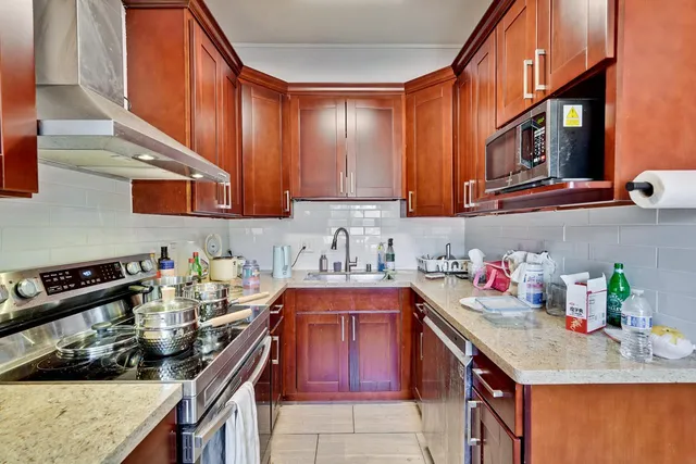 a kitchen with a stove and a sink