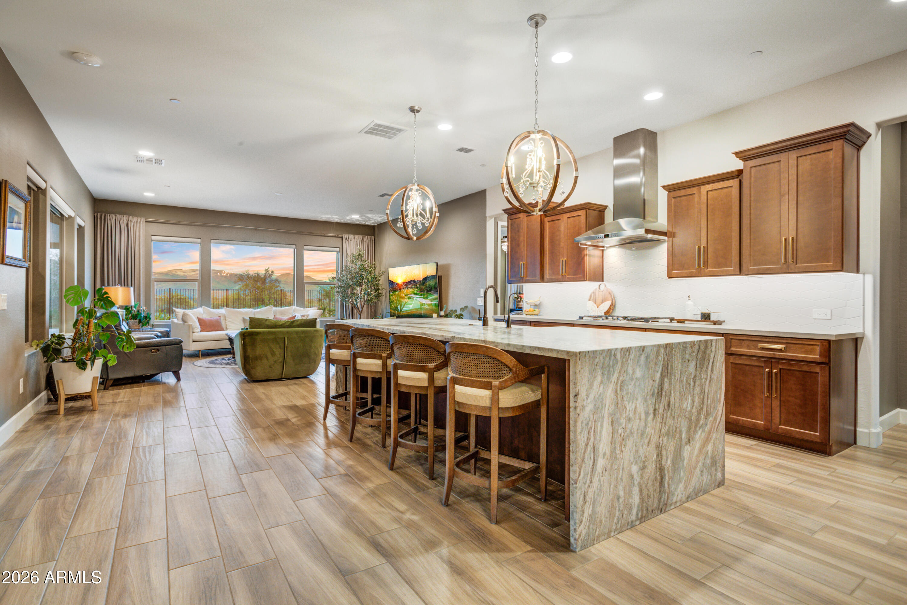 28517 North Camel Rock Court Rio Verde, AZ 85263 - Photo 7 of 39 a large kitchen with lots of counter space and dining table