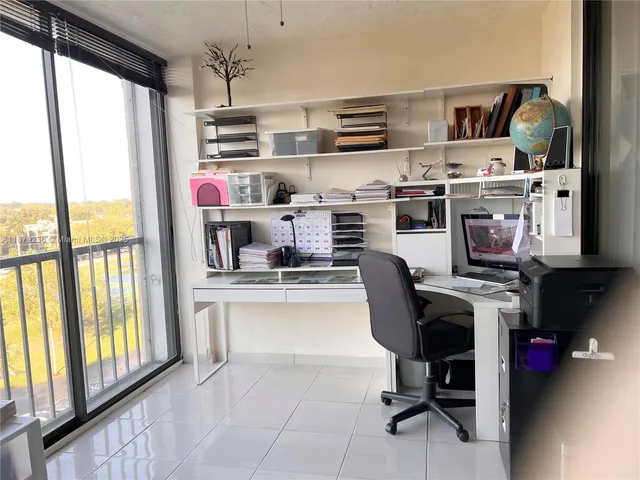 a kitchen with stainless steel appliances a stove a sink and a refrigerator