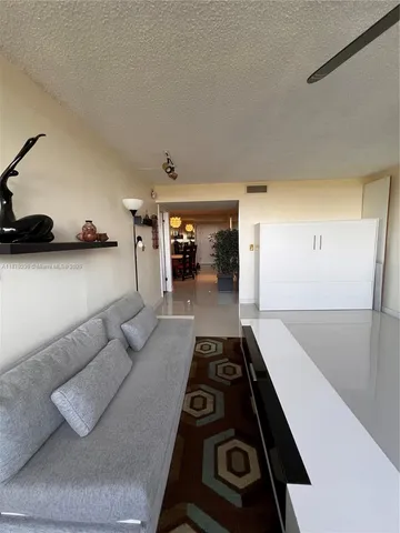 a kitchen with a stove and a refrigerator