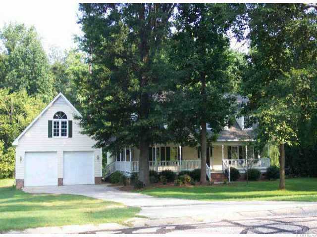 5012 Winterlochen Road Raleigh, NC 27603 - Photo 1 of 1 a front view of a house with a garden
