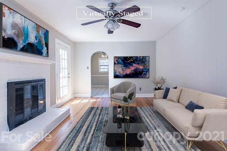 7410 Marlbrook Drive Charlotte, NC 28212 - Photo 2 of 16 a living room with furniture and a fireplace