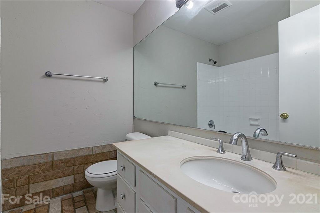 7410 Marlbrook Drive Charlotte, NC 28212 - Photo 14 of 16 a bathroom with a sink toilet and vanity