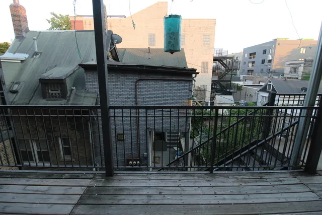 a view of a balcony with city view